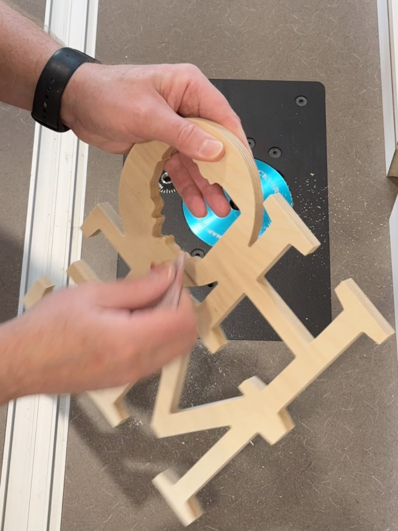 Sanding wooden Home sign